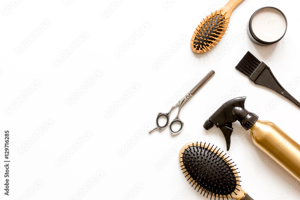 combs and hairdresser tools on white background top view