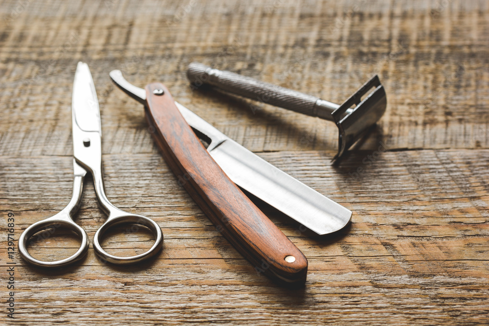 Tools for cutting beard barbershop on wooden background