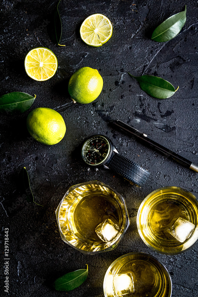 glass of scotch on dark background top view