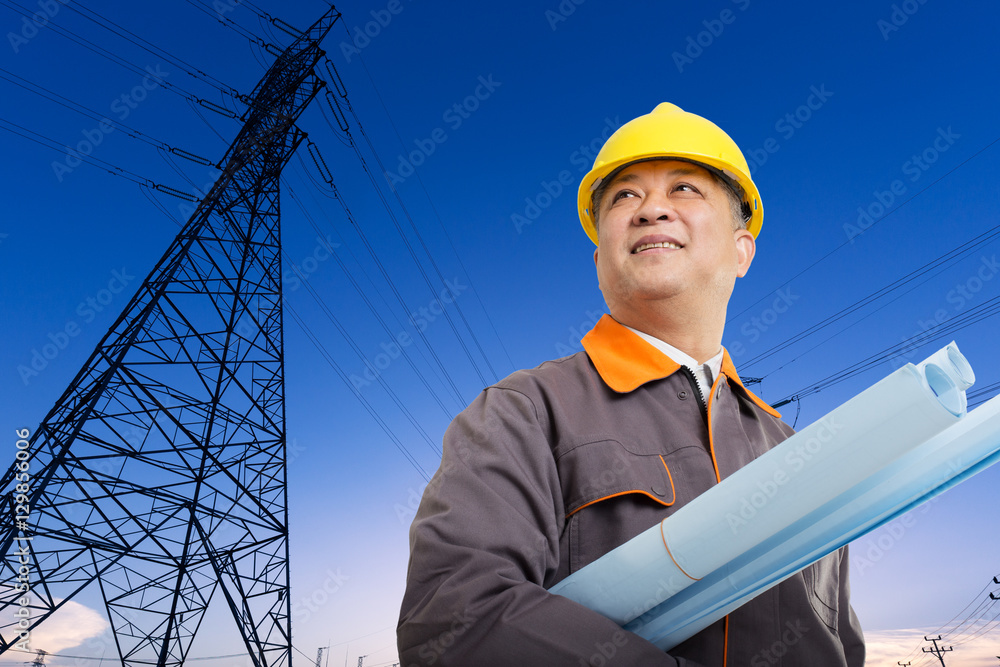 asian man engineer with blueprint and pylon