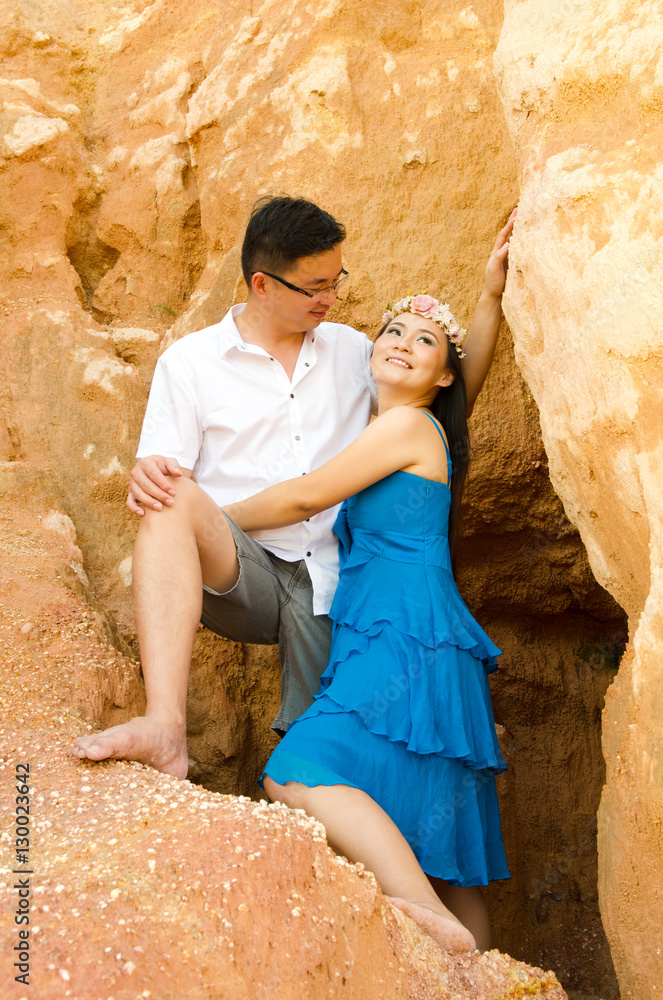 Asian couple hugging with canyon background. Valentines day concept