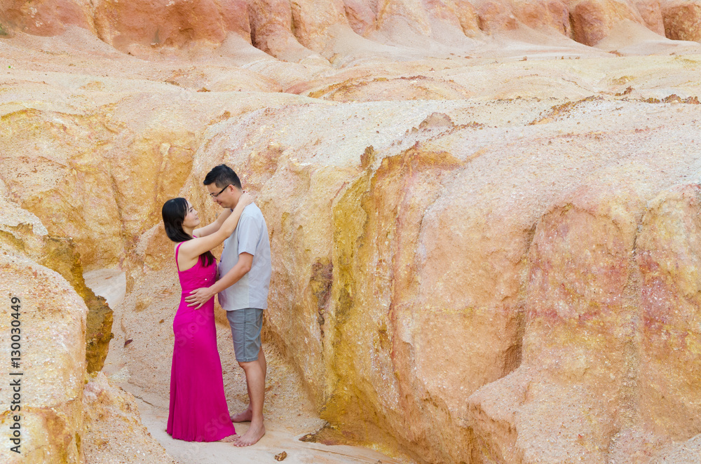 Asian couple hugging with canyon background. Valentines day concept