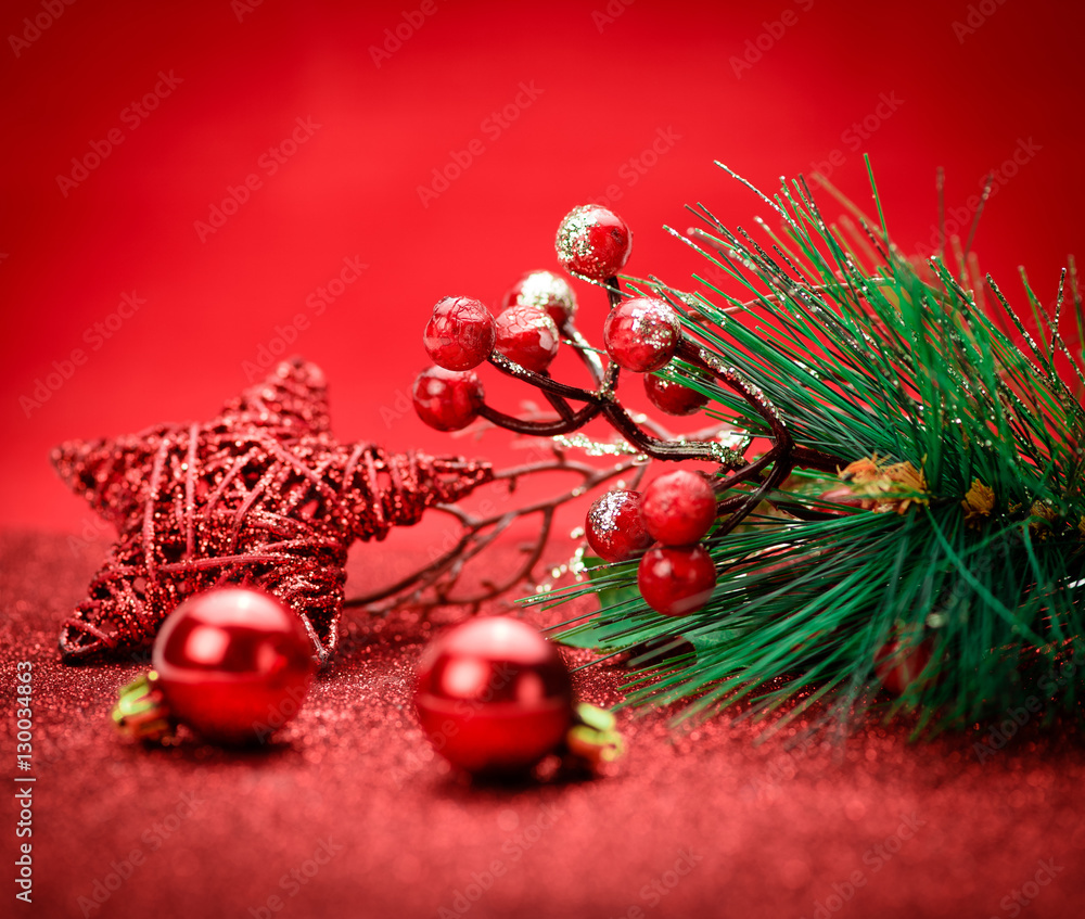 Christmas holiday concept. Red balls with star and branch tree on background. Bokeh.