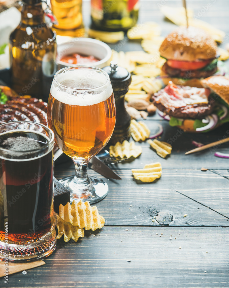 Beer and snack set. Octoberfest food frame concept. Beers assortment, grilled sausages, burgers, fri