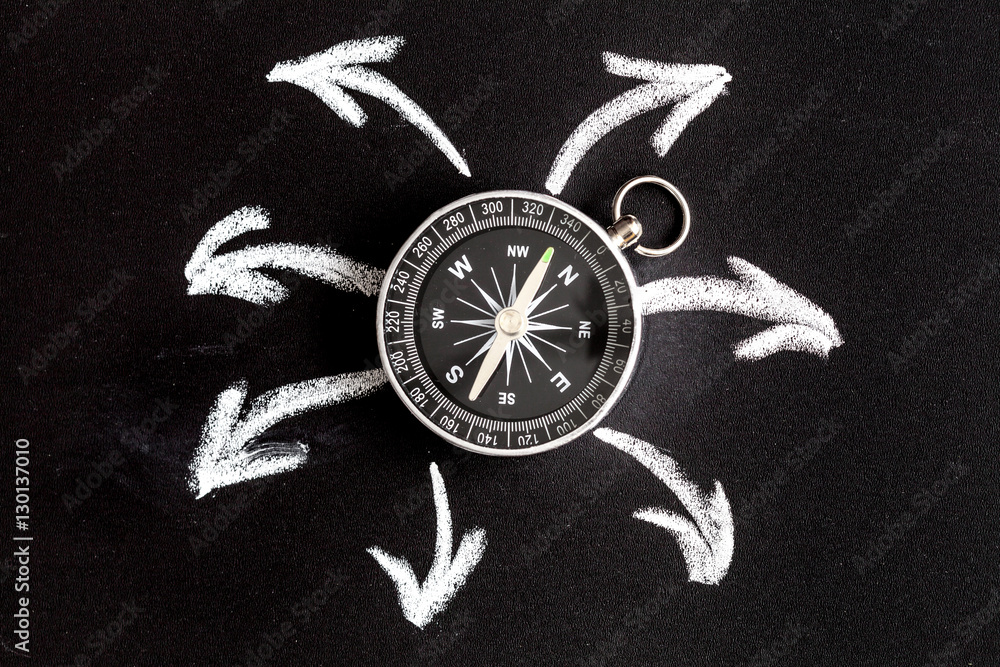 compass on dark background concept - arrows, direction top view