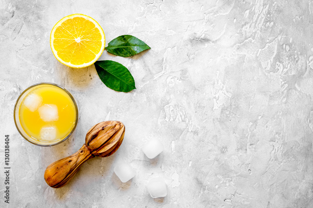 freshly squeezed orange juice on concrete background top view