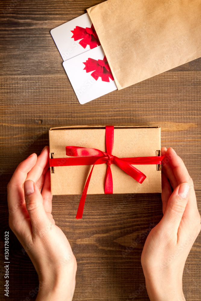 concept of gift cards on wooden background top view