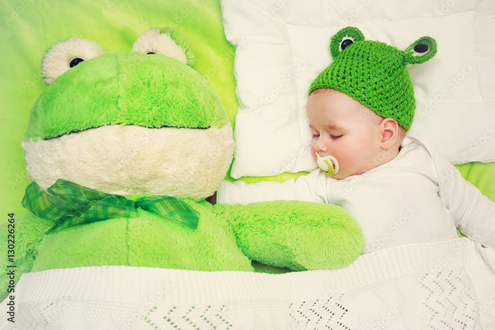 Baby on green blanket