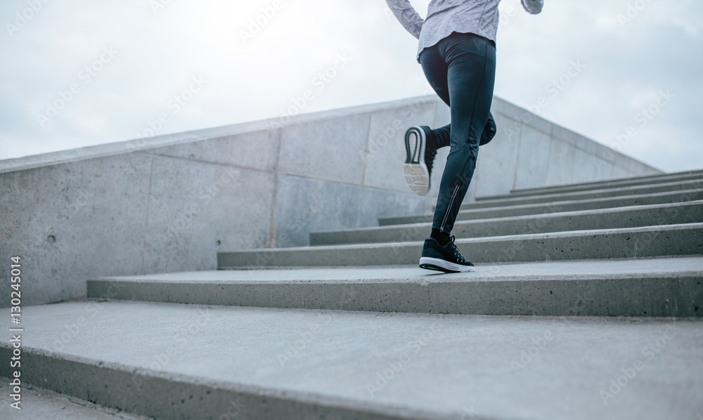 Woman running up the stair