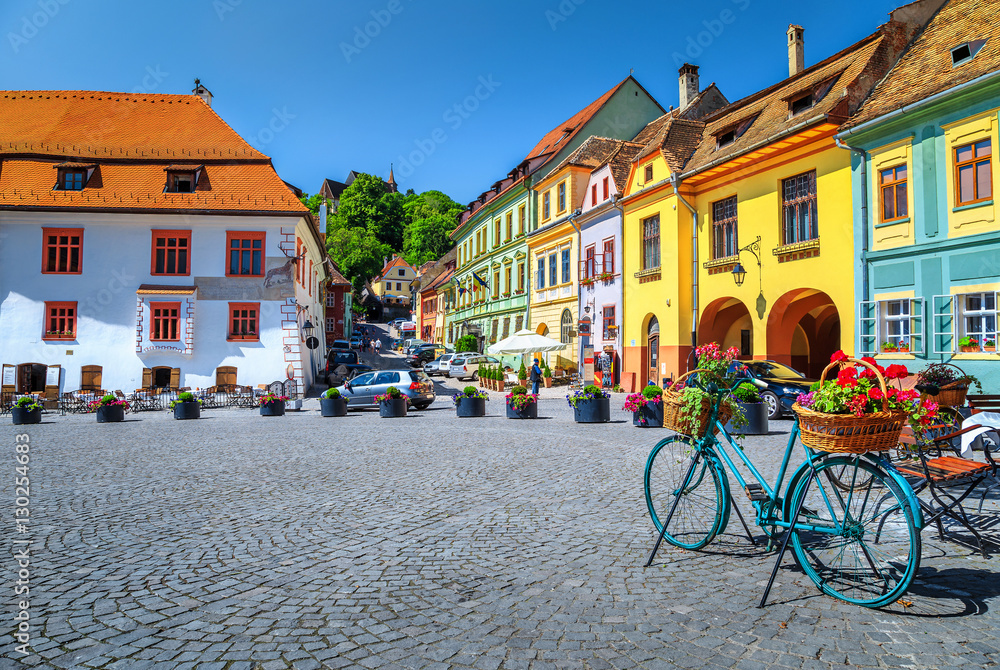 Famous medieval street cafe bar,Sighisoara,Transylvania,Romania,Europe