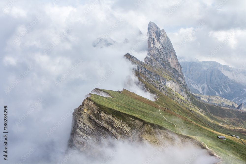 Mountains of Secede during a cloudy sunrise in Italian Dolomites.