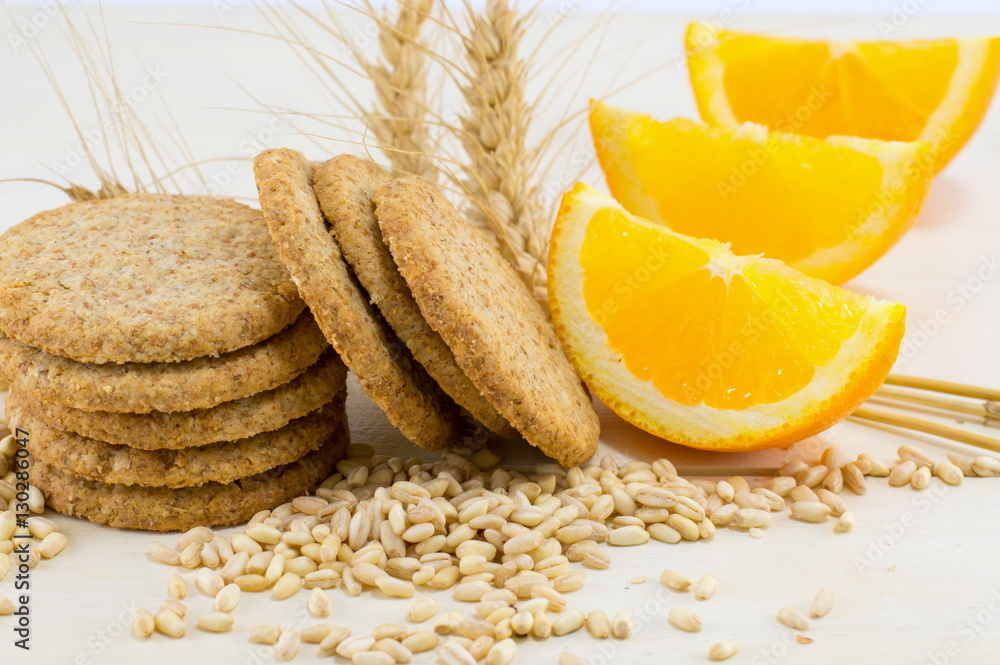 Integral biscuits with orange and wheat seeds