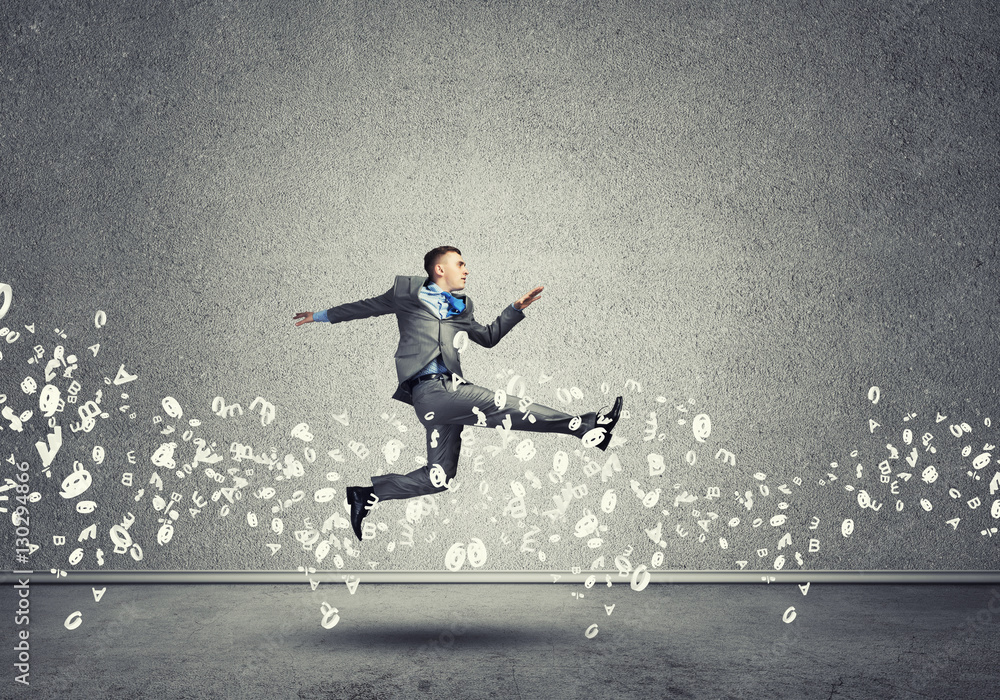 Businessman jumping high