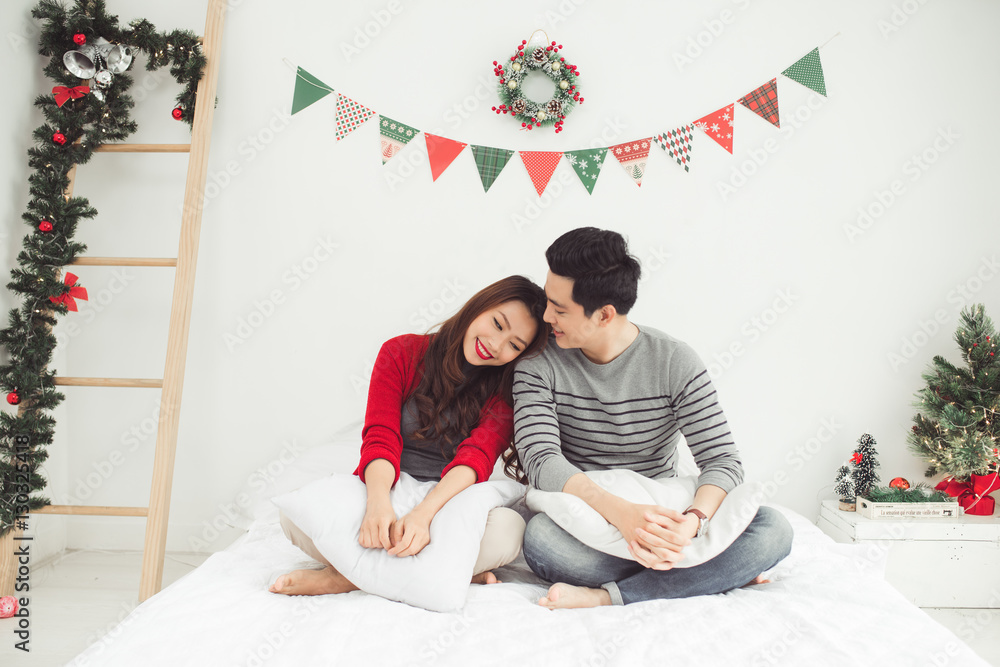 Christmas. Asian Couple Lovers Celebrating New Year at Home.