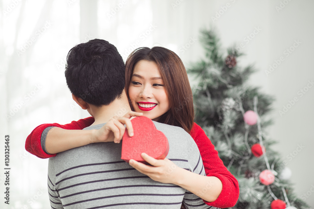 Christmas. Asian Couple Lovers Celebrating New Year at Home.