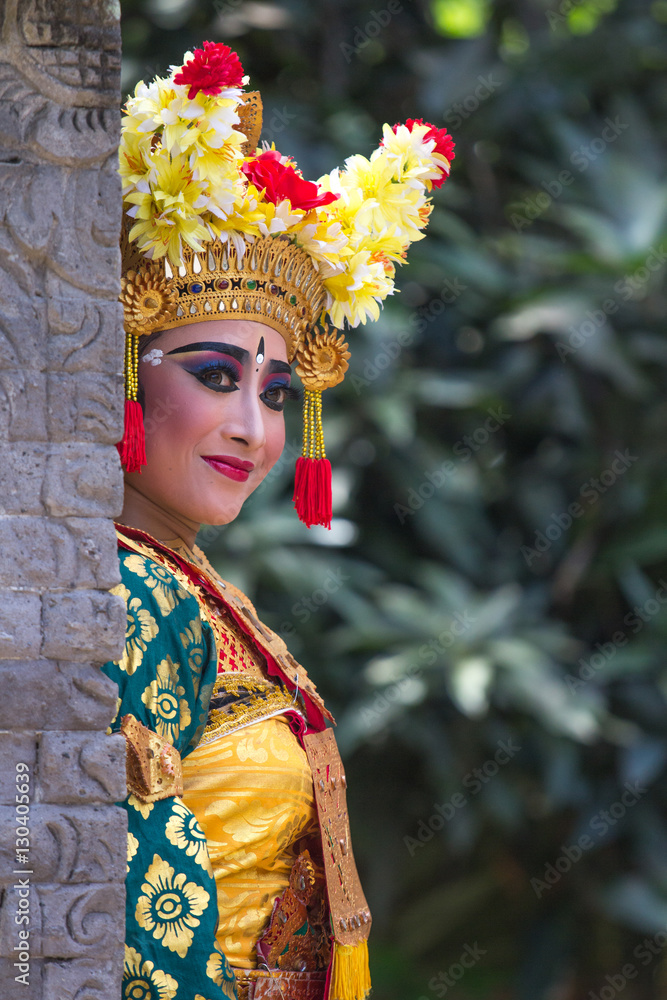 Portrait of a beautiful young female Balinese dancer in traditional costume. Bali, Indonesia.