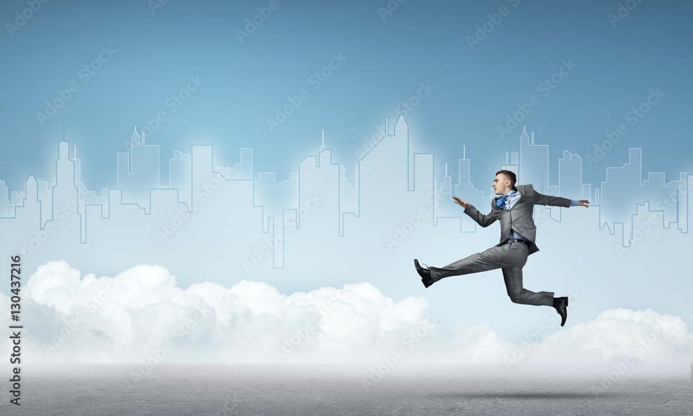 Businessman jumping high