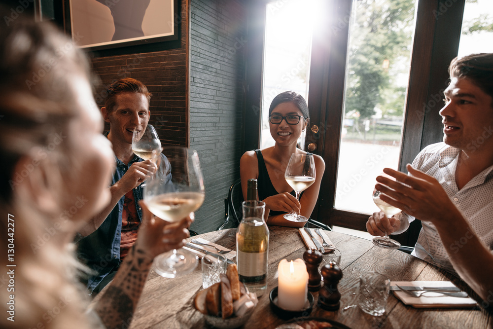 Friends at a restaurant drinking wine