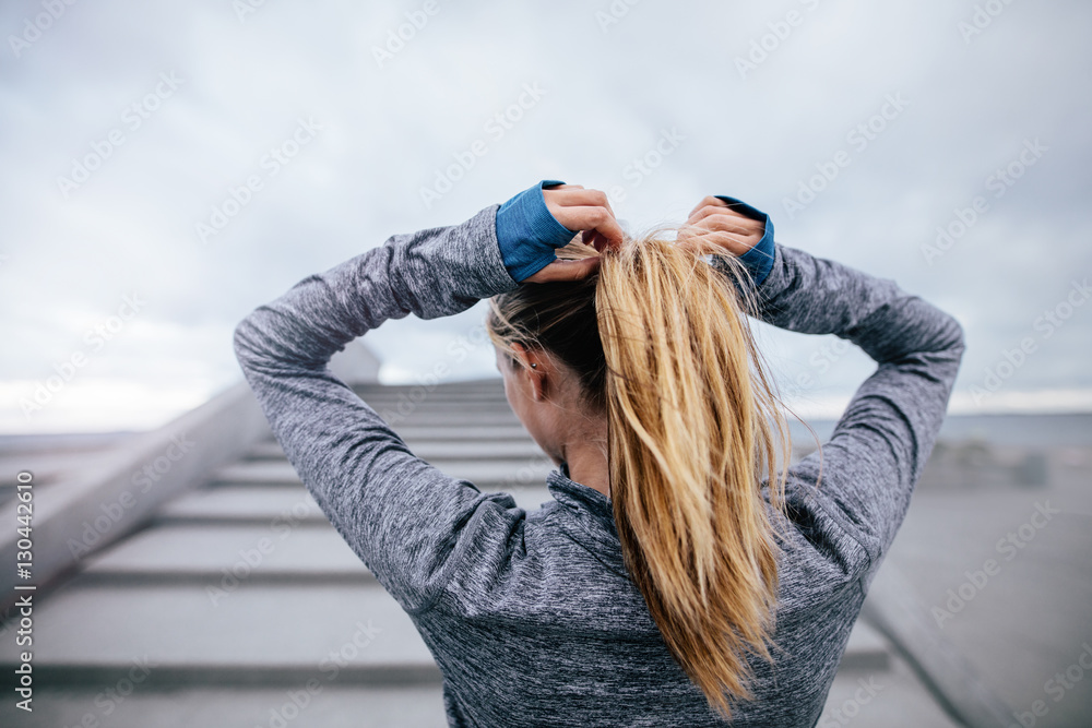 Young woman getting ready for training