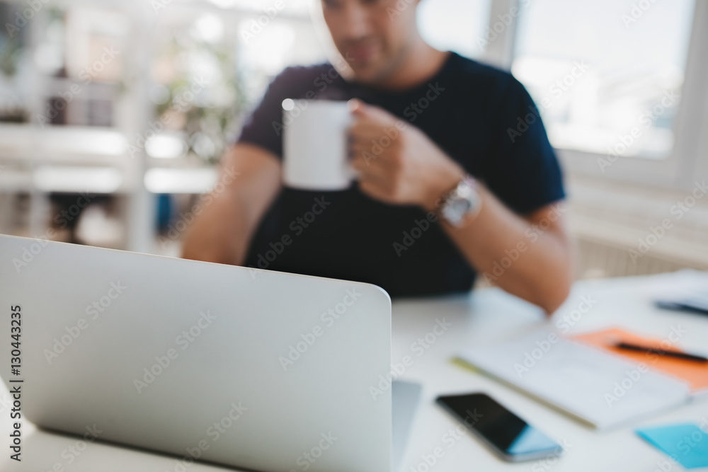 Business man work desk with focus on laptop