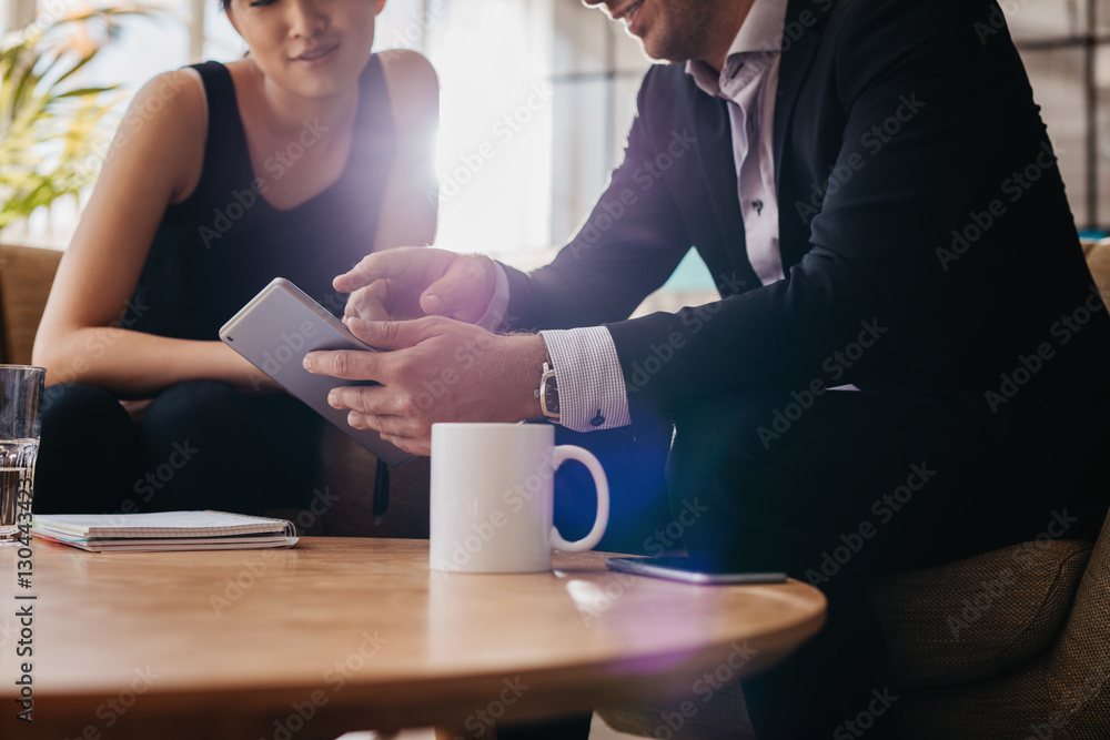 Business people having a meeting in office lobby