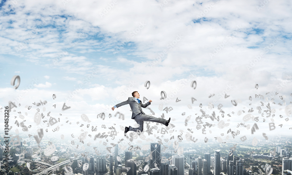 Businessman jumping high