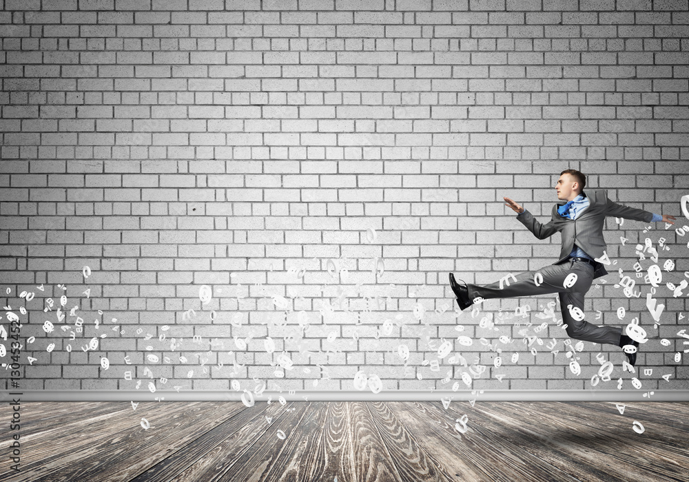 Businessman jumping high