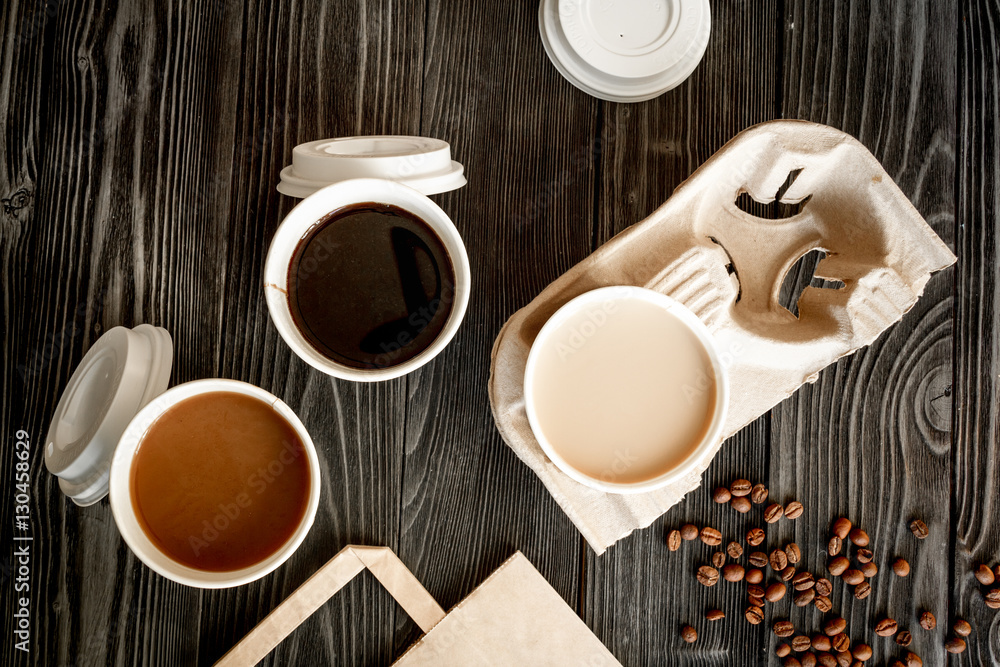 coffee cup take away at wooden background top view