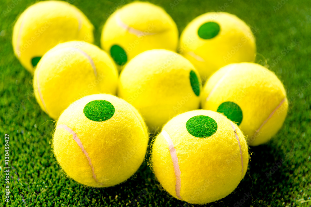 tennis ball on green background close up