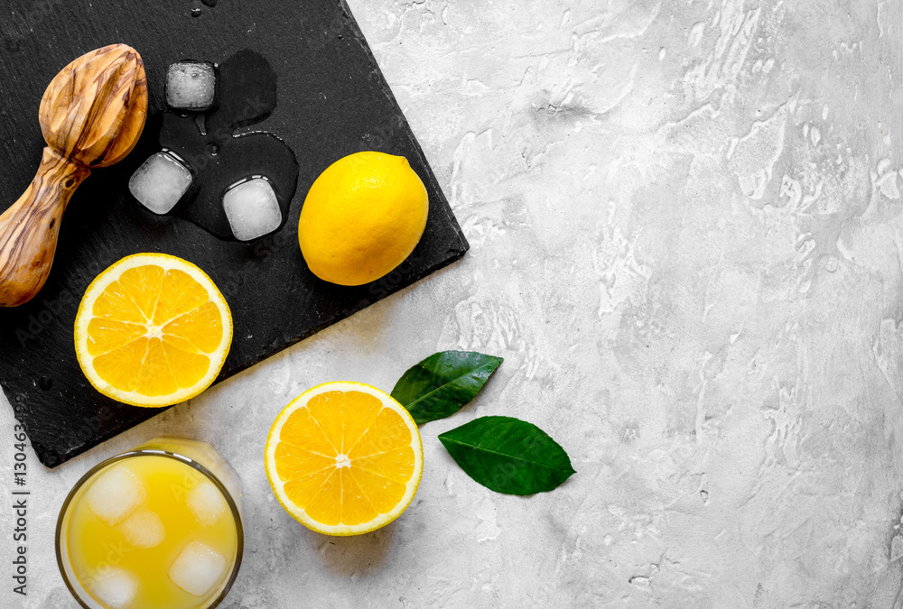 freshly squeezed orange juice on concrete background top view