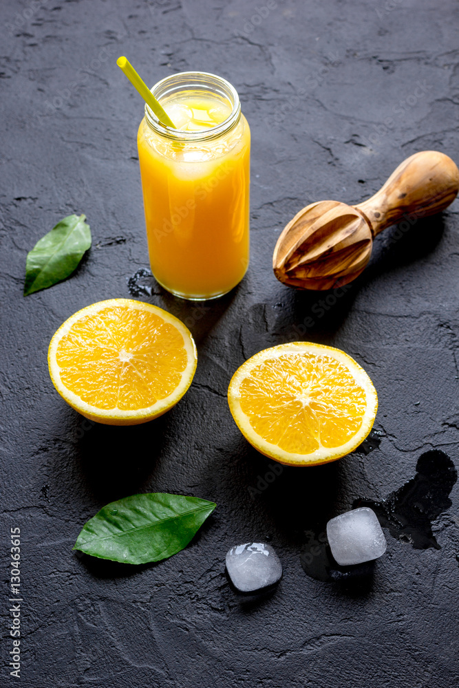 freshly squeezed orange juice on dark background