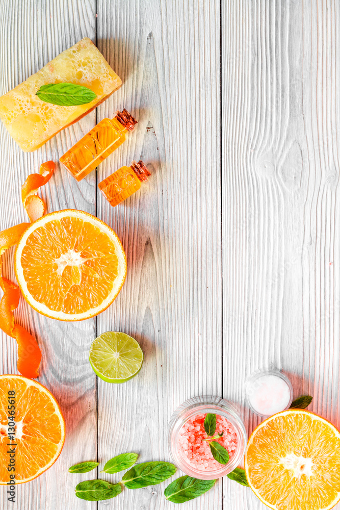 organic cosmetic with citrus on wooden background top view