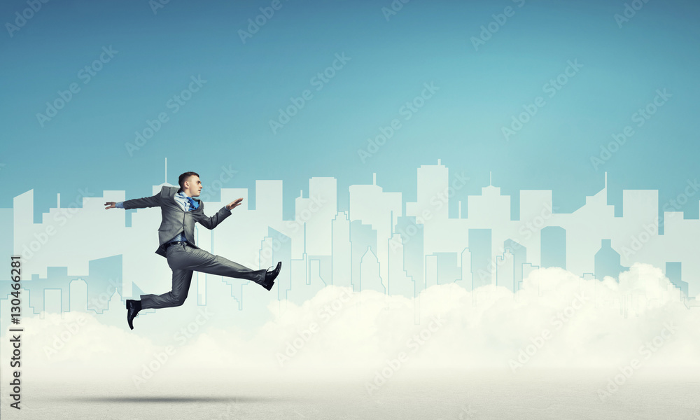 Businessman jumping high