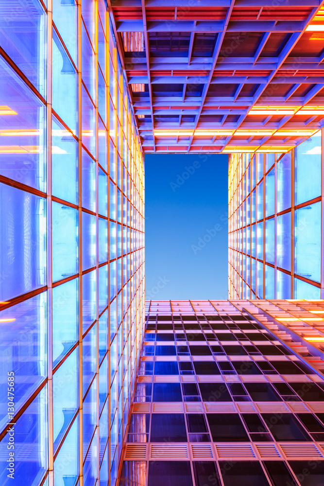 Modern skyscrapers glass wall in the evening