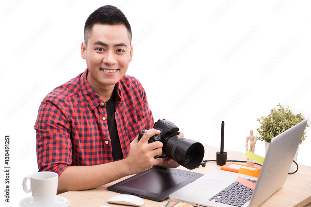 Professional photographer. Portrait of confident young man in sh