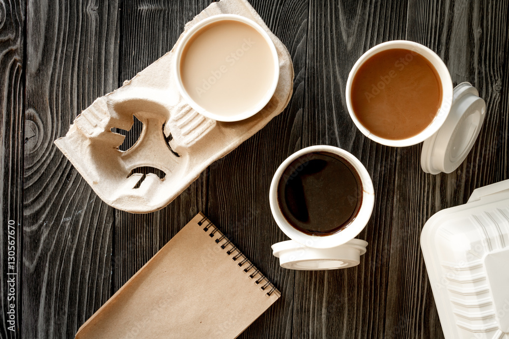 coffee cup take away at wooden background top view