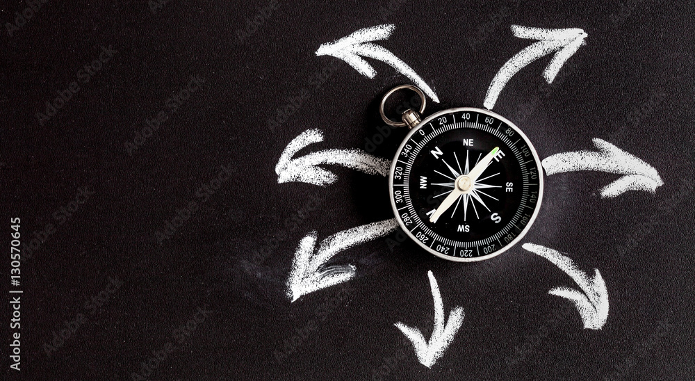 compass on dark background concept - arrows, direction top view