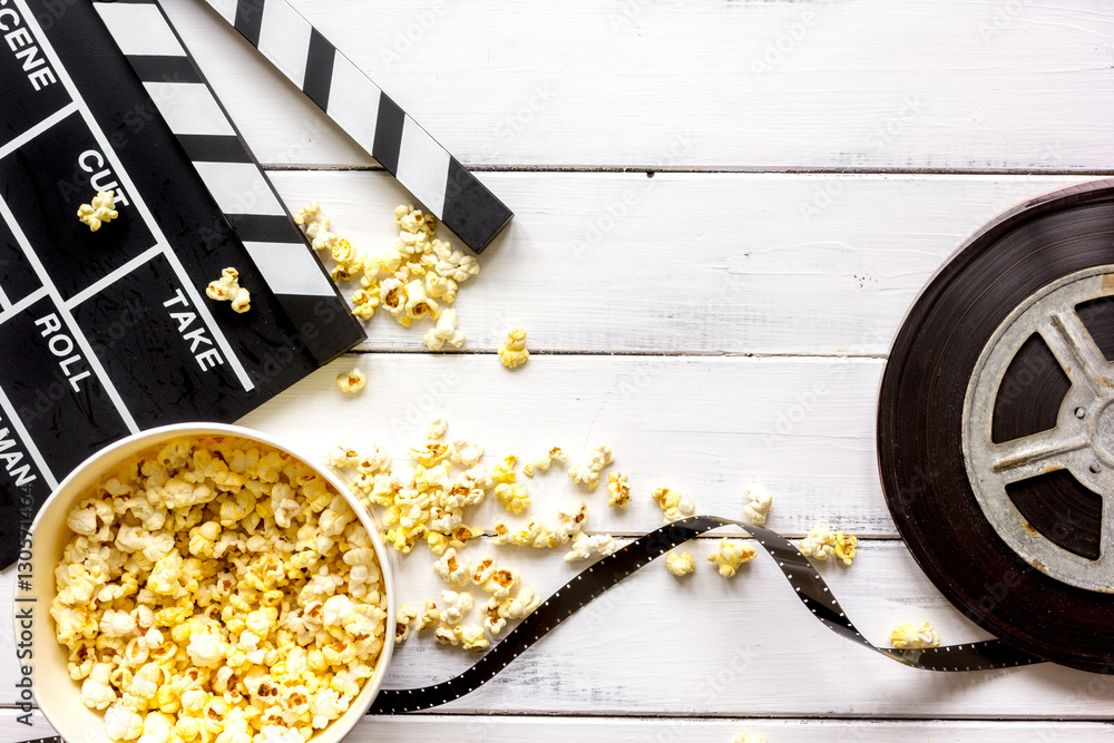 watching movie with popcorn on wooden background top view