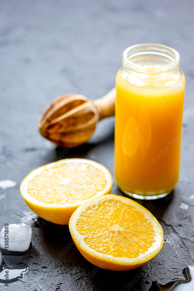 freshly squeezed orange juice on dark background