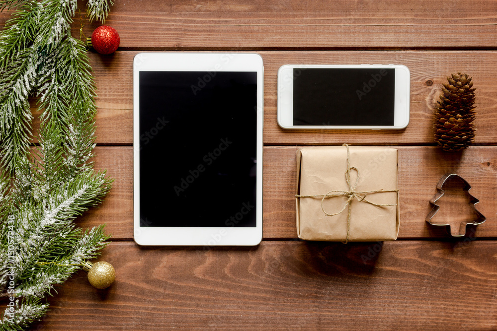 smartphone, tablet, shopping for new year online wooden table