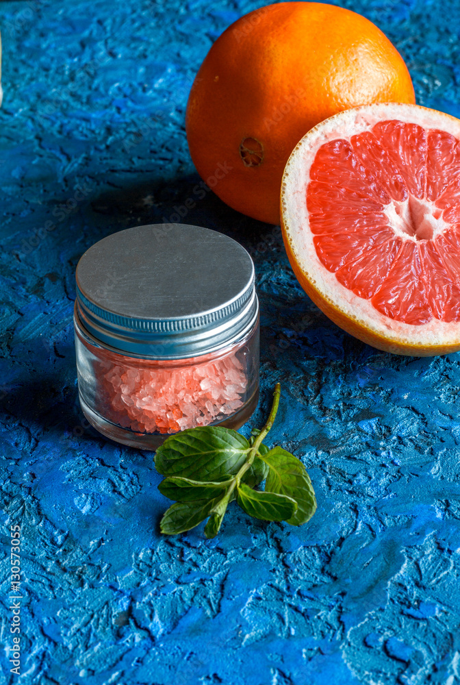 organic cosmetic with citrus on blue background