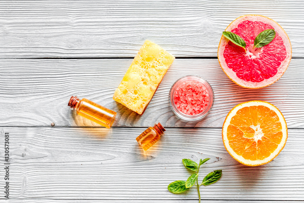 organic cosmetic with citrus on wooden background top view