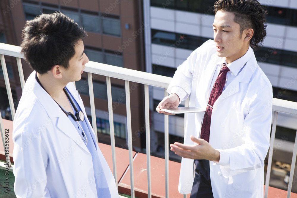 Doctors talking on the hospitals rooftop