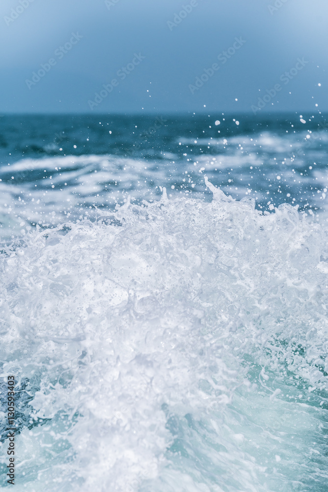 Splash water from running of speedboat in the ocean