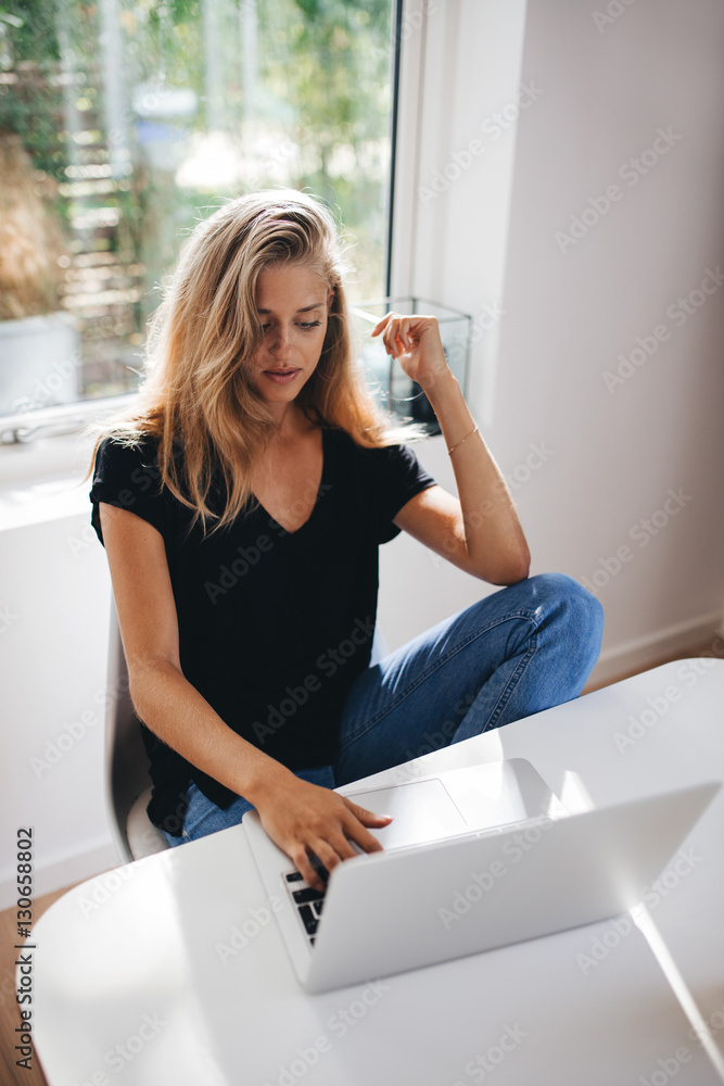 Female working on laptop at home