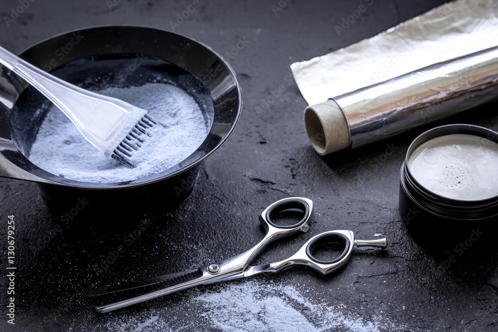 hair dye with brush on dark background