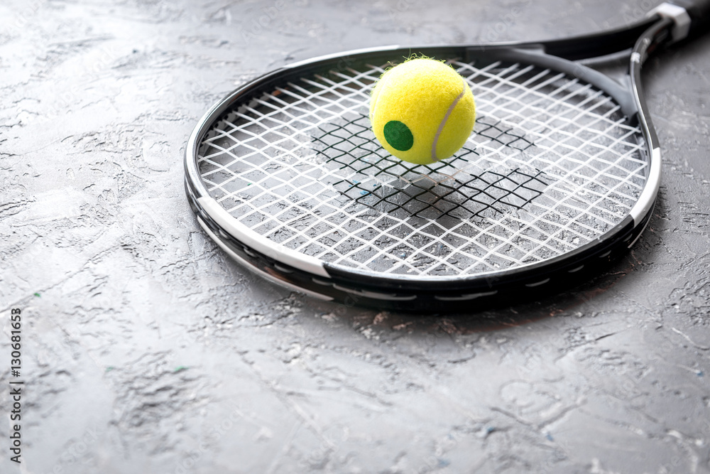 tennis racket on gray background close up