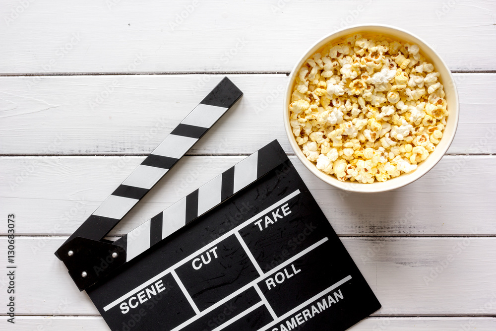 watching movie with popcorn on wooden background top view