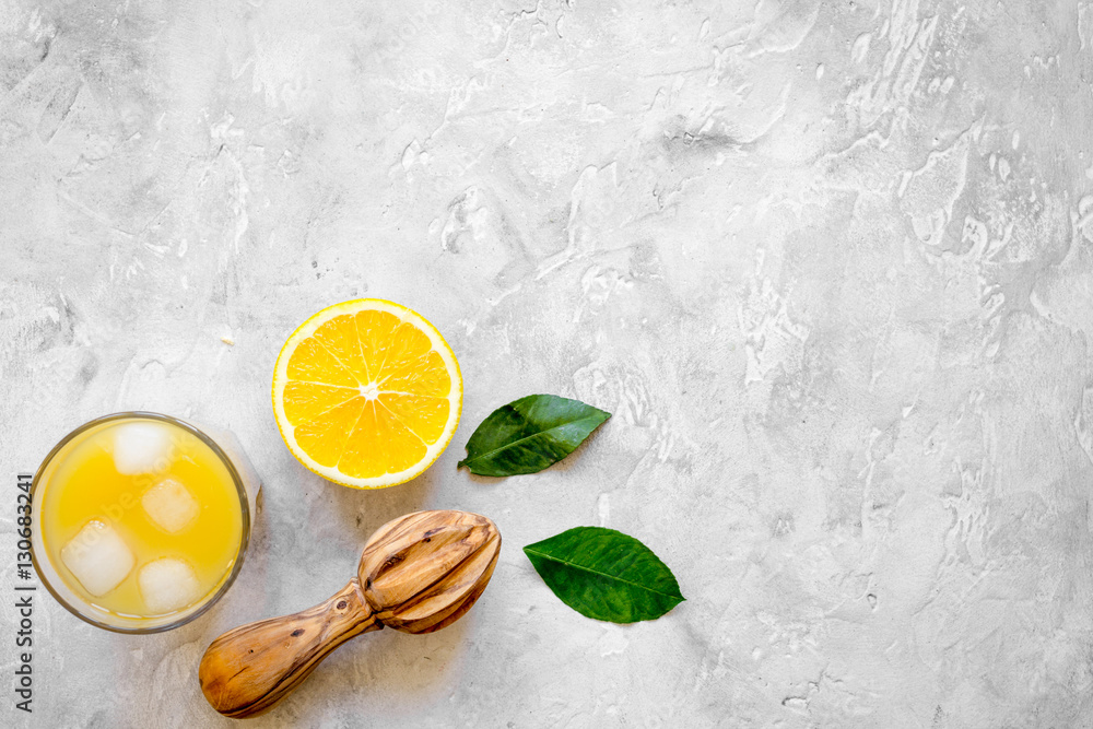 freshly squeezed orange juice on concrete background top view