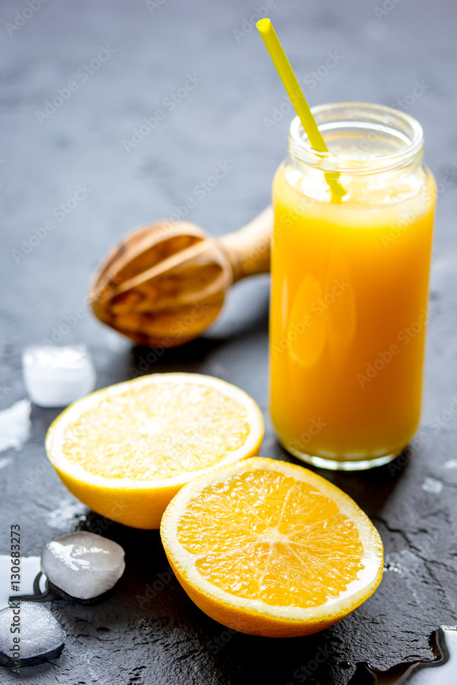 freshly squeezed orange juice on dark background